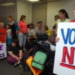 Community members protest BCRA in the office of Sen. Jerry Moran in Kansas. Photo courtesy of Yahoo.