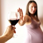 Pregnant Woman Declining Glass Of Wine