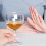man offer alcohol but woman refuses