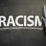 Stop hands sign with USA flag and RACISM / Flag blackboard concept (Click for more)