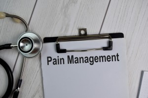Pain Management text write on a paperwork isolated on office desk. Healthcare/Medical concept