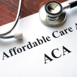 Words Affordable Care Act  ACA written on a paper.