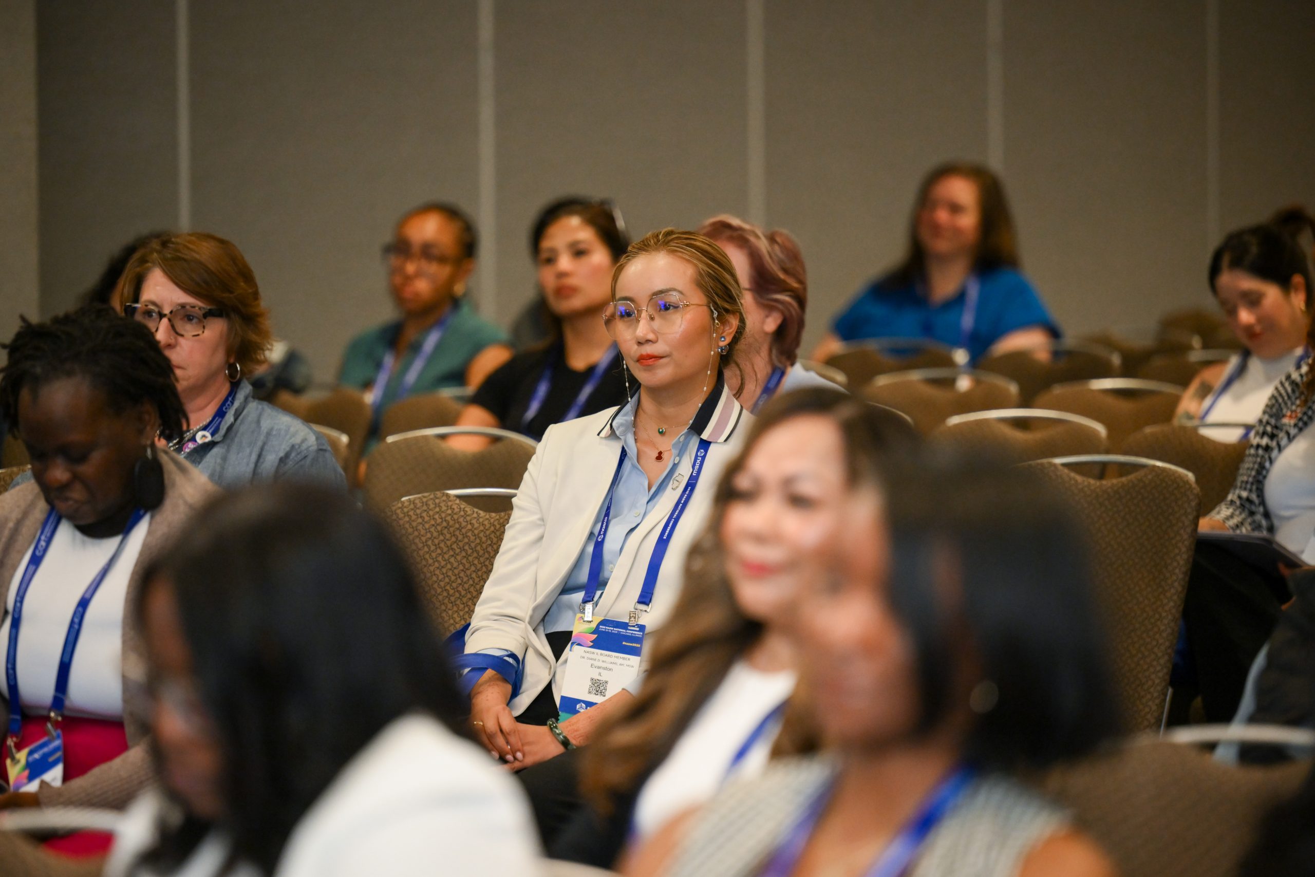 Women sitting in audience at conference
