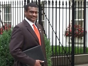 NASW CEO Angelo McClain enters White House to attend an Oct. 16 meeting on the Affordable Care Act.