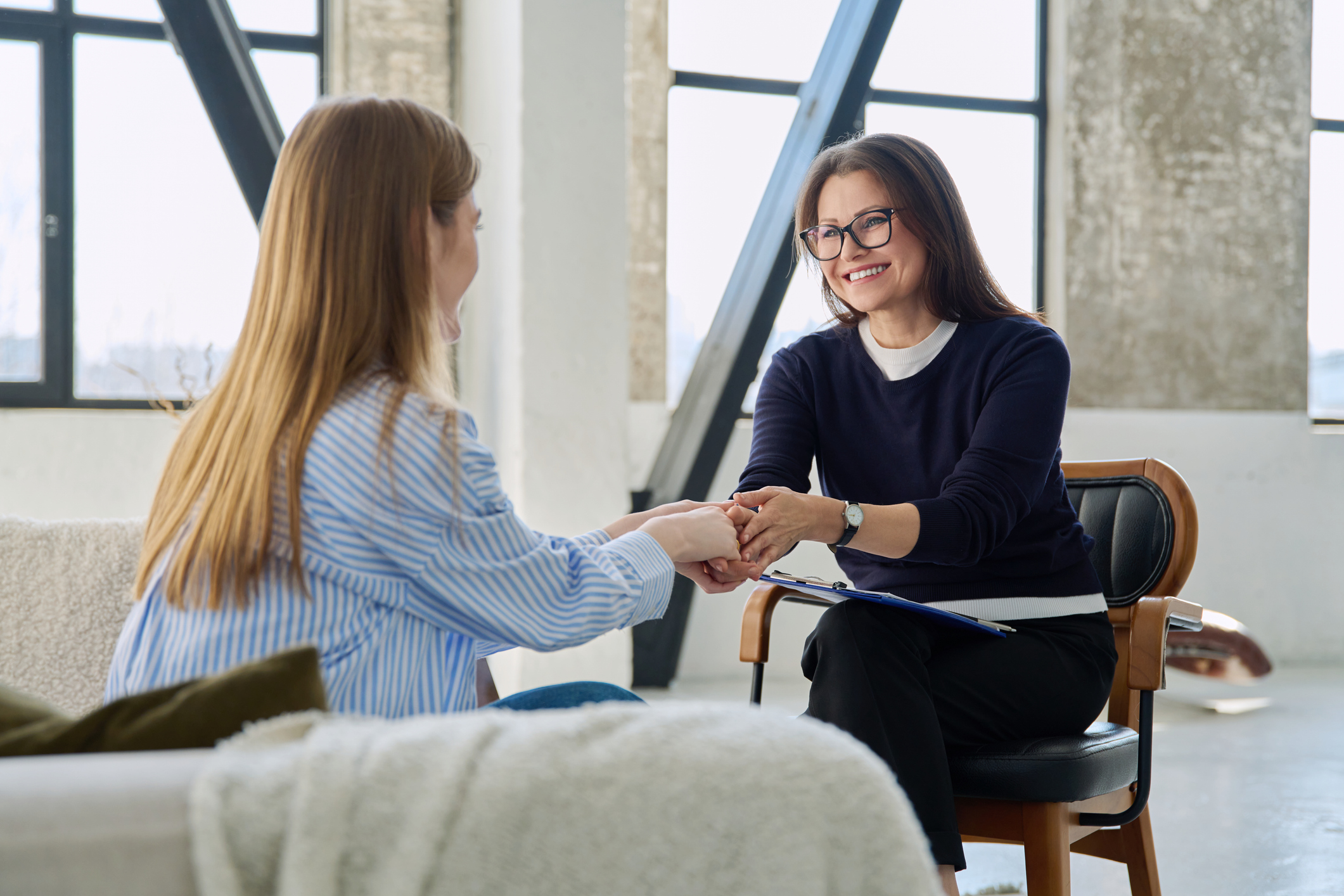 Professional female therapist counselor psychologist working with young woman patient Social worker disusses FASD
