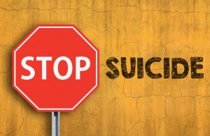 STOP SUICIDE message written on wall