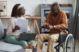 African-American Wheelchair User Talking to Business Consultant