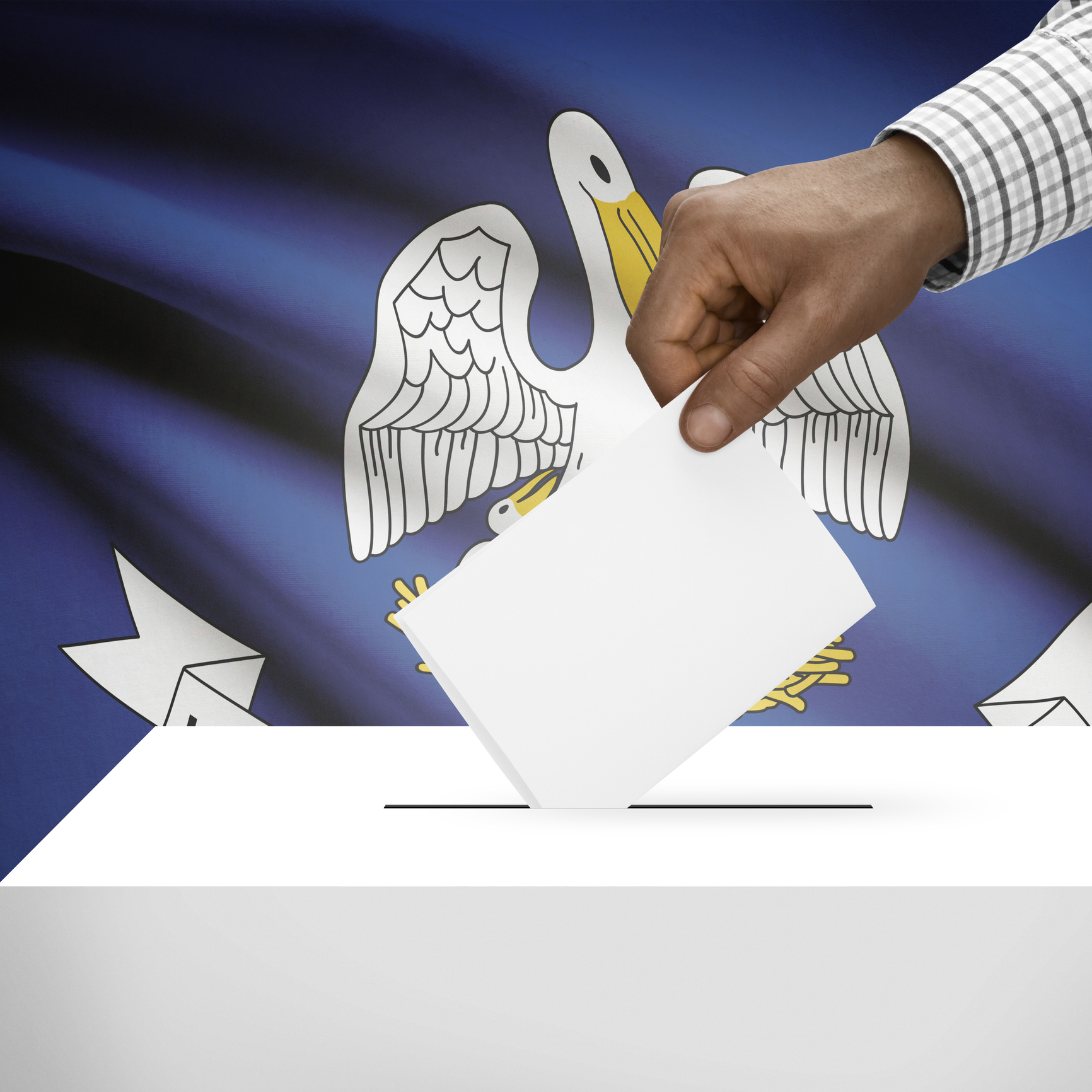 The hand of a Black Man puts a ballot un the ballot box with a Louisiana flag in the background.