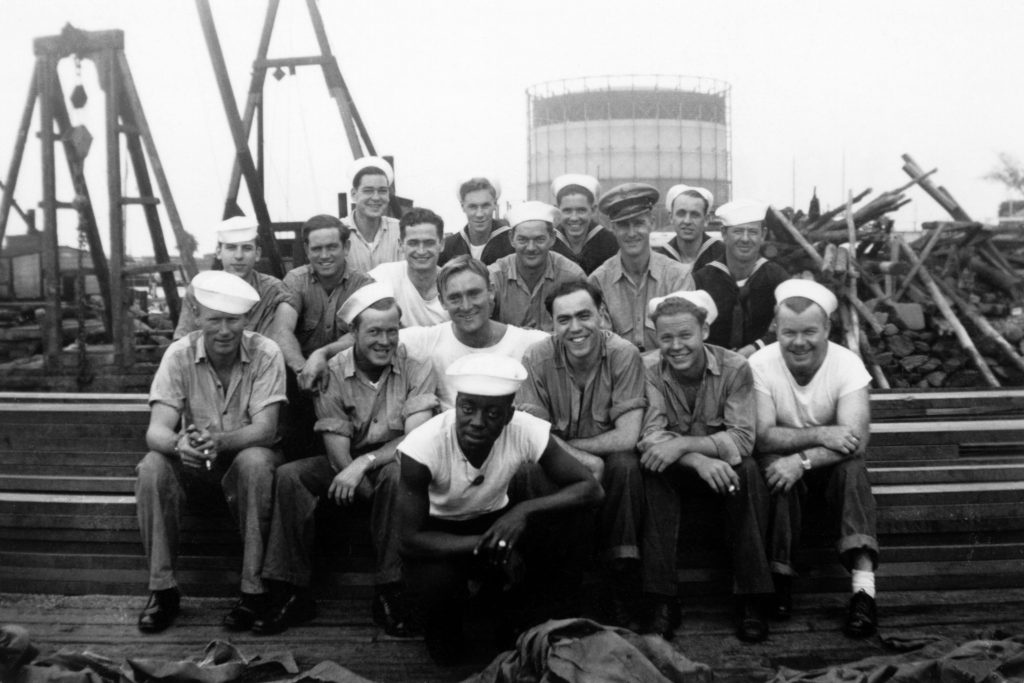 black and white photo of African-American man with his white Navy comrades