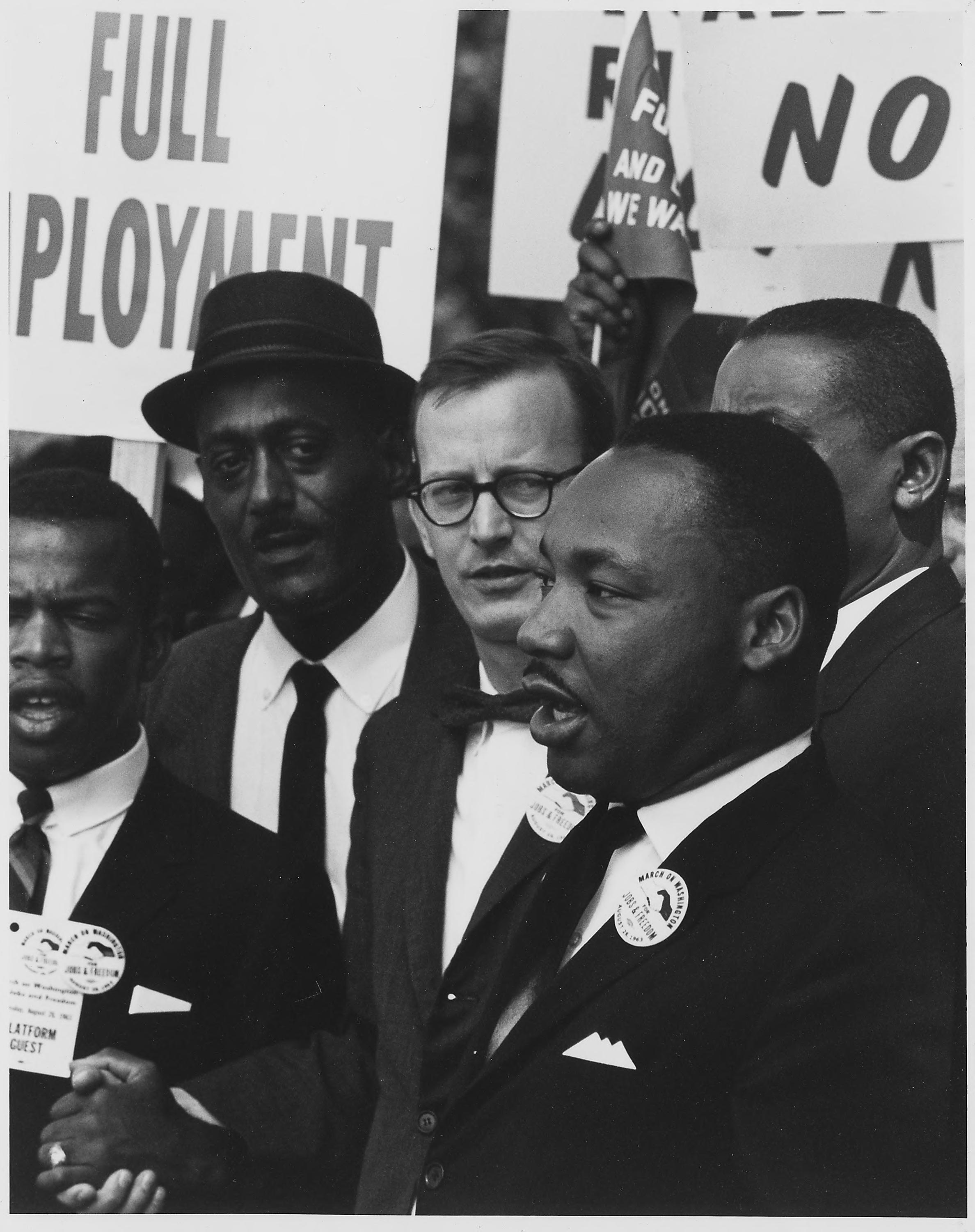 Dr Martin Luther King Jr talking, among men, John Lewis