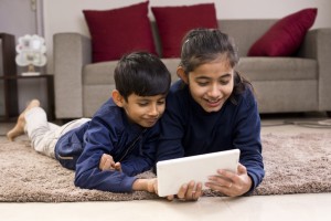 Children enjoying media content on digital tablet